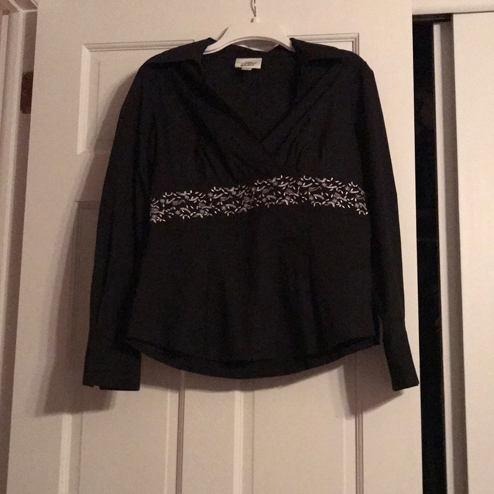 Black collared shirt with white detailing at waist